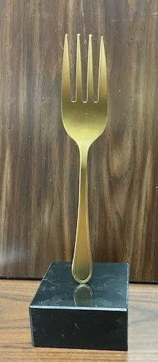 10" golden fork on marble base